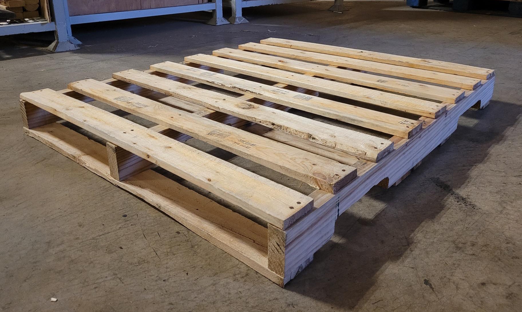 Structurally sound Grade A used wooden pallet, reconditioned for dependable use in general shipping and warehousing.