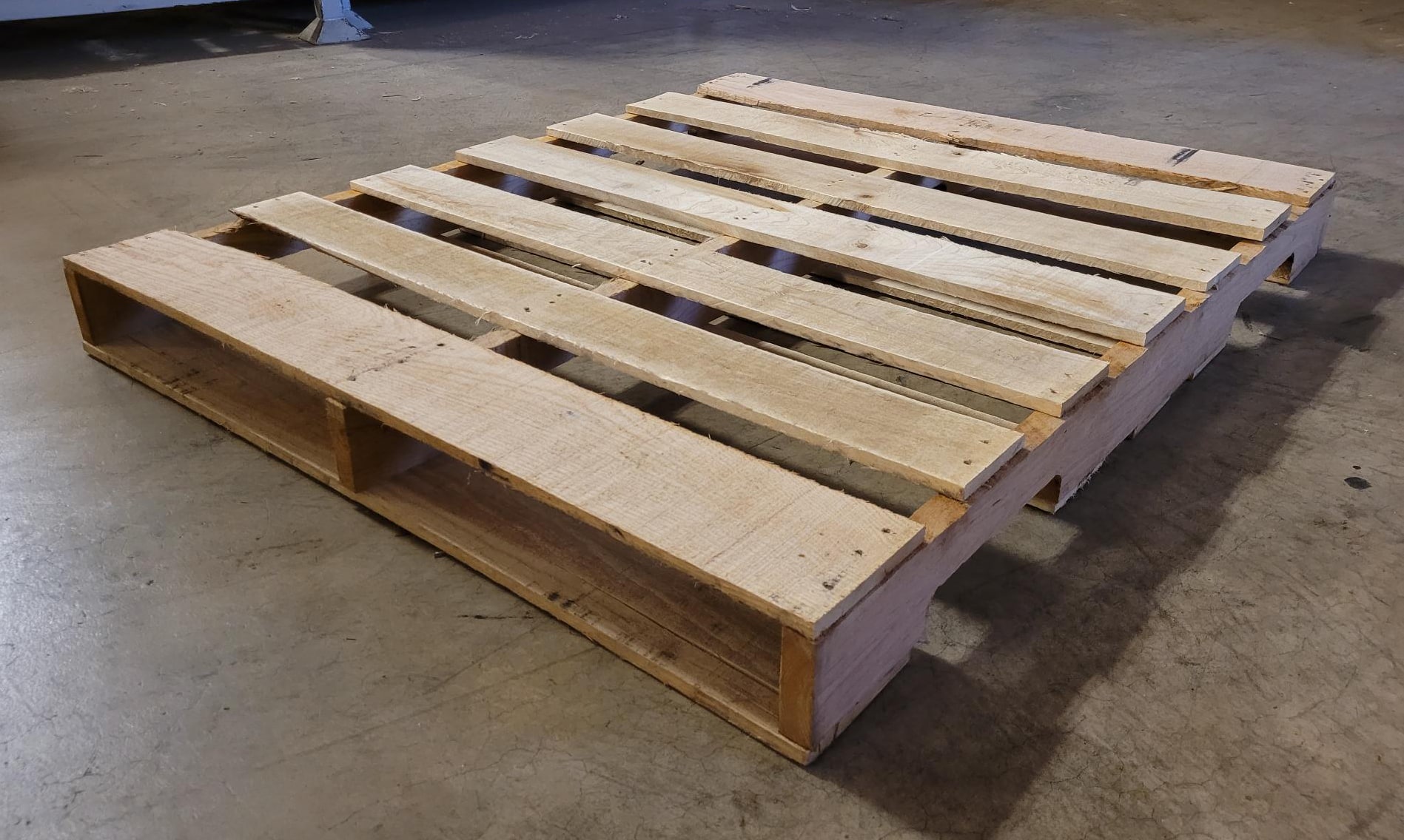 Premium Grade AAA recycled wooden pallet, like-new condition, ideal for high-value logistics and uniform stacking.
